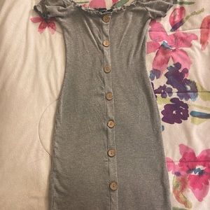 Grey knee length dress with light brown buttons. Shoulder sleeves.